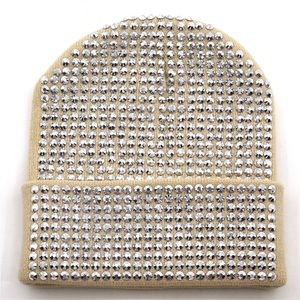 Tan knit hat with crystal like beading